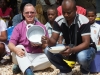 distribution-ankilifaly-for-ambohitsabo-bishop-todd-with-president-eating-rice